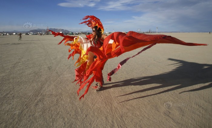 Julia Kwinter dances on the Playa during the Burning Man 2015 "Carnival of Mirrors" arts and music festival in the Black Rock Desert of Nevada