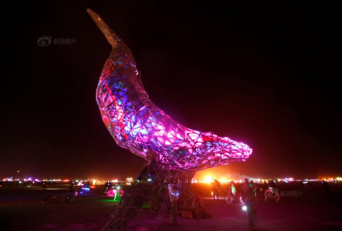 The Space Whale is lit as the Man burns as approximately 70,000 people from all over the world gather for the 30th annual Burning Man arts and music festival in the Black Rock Desert of Nevada, U.S.