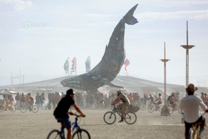 Participants gather around The Space Whale art installation as approximately 70,000 people from all over the world gather for the 30th annual Burning Man arts and music festival in the Black Rock Desert of Nevada
